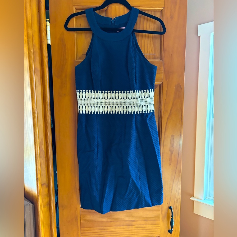 Navy blue Lilly Pulitzer dress with gold detail.